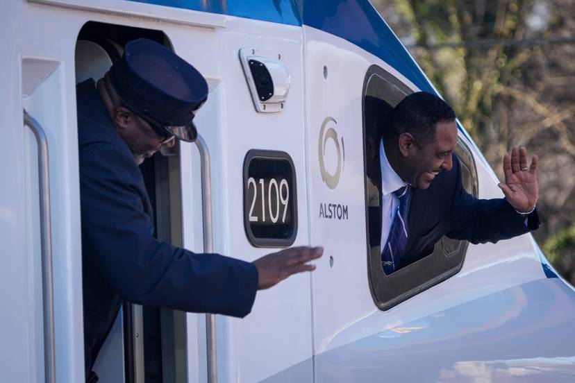 Amtrak workers greet President Joe Biden as he arrives to Baltimore on Jan. 30, 2023.